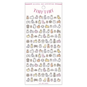 May include: A sheet of stickers featuring a variety of cute, cartoon bunnies in different poses and colors. The stickers are arranged in rows on a white background. The text "Tiny Tiny" and "Relaxed and Comforting" are printed at the top of the sheet. The text "We are Usagi" is printed at the bottom of the sheet.