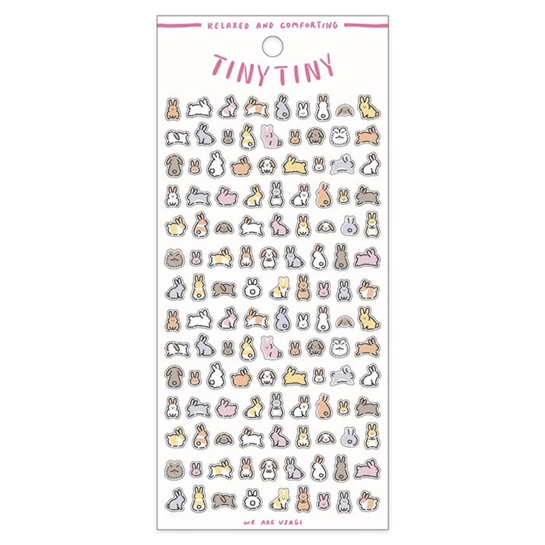 May include: A sheet of stickers featuring a variety of cute, cartoon bunnies in different poses and colors. The stickers are arranged in rows on a white background. The text "Tiny Tiny" and "Relaxed and Comforting" are printed at the top of the sheet. The text "We are Usagi" is printed at the bottom of the sheet.