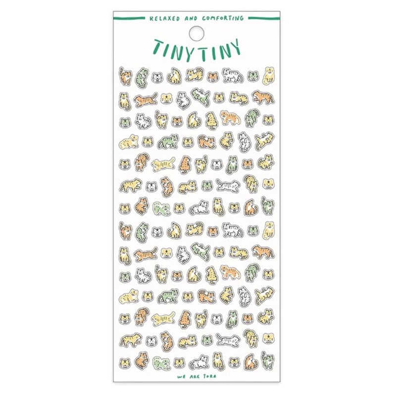 May include: A sheet of stickers featuring a variety of cute cats in different poses. The cats are drawn in a simple, cartoon style and are colored in shades of green, yellow, and orange. The stickers are arranged in a grid pattern on a white background. The text "Tiny Tiny" and "We Are Tora" are printed on the sheet.