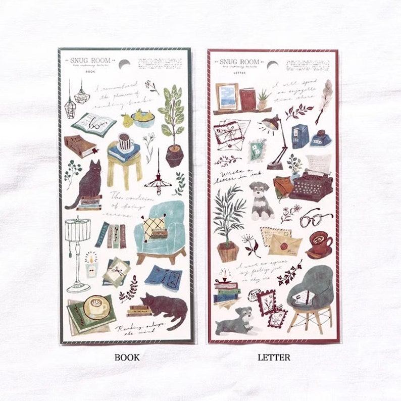 May include: Two sheets of stickers with illustrations of a cozy room with a cat, books, a chair, a lamp, and a plant on one sheet and a dog, a typewriter, a letter, and a plant on the other sheet. The text "Snug Room" is at the top of each sheet. The words "Book" and "Letter" are printed below each sheet.