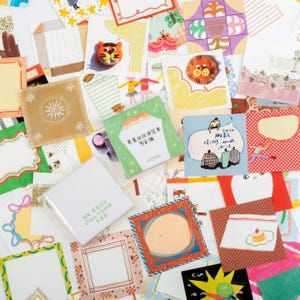 May include: A collection of square memo pads and sticky notes featuring various colorful illustrations, including a tiger, a lion, a dessert, and abstract patterns. The papers display diverse borders, graphic designs, and Chinese text characters.