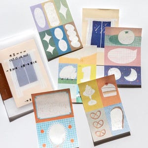 May include: A set of 10 colourful paper stickers with various designs, including a sheep, a window with stars, a cake, a pretzel, and a cloud. The stickers are ideal for adding a touch of whimsy to journals, planners, and other paper crafts.