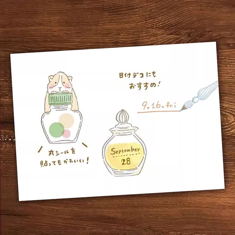 May include: A hand-drawn illustration of a bottle with a guinea pig on top, a bottle of perfume, and a handwritten note that says "Date deco also recommended! 9.16. fri September 28 / Round stickers also cute!"