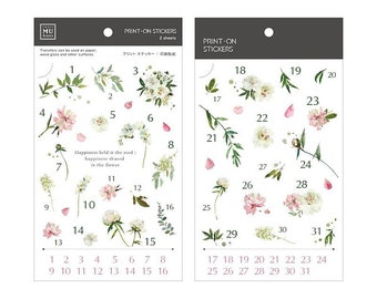 May include: A sheet of stickers featuring watercolor illustrations of white and pink flowers with green leaves. The stickers are numbered 1 through 31. The text "PRINT-ON STICKERS" and "2 sheets" is printed at the top of the sheet. The text "Happiness held is the seed: happiness shared is the flower" is printed in the center of the sheet.