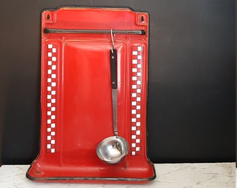 French vintage enamel kitchen ustensil rack. Red and white check pattern.