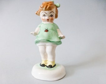 Porcelain figurine,Little girl with ladybug,Antique child figurine,Vintage Hungarian  porcelain figurine FREE SHIPPING