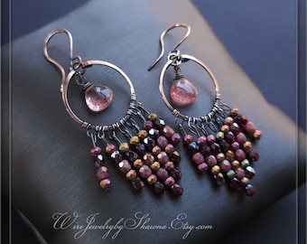 May include: Copper wire earrings with a circular design, featuring a dangling pink gemstone and beaded fringe in shades of burgundy, gold, and brown. The earrings have a unique, handcrafted appearance. Text on the image reads: Wire Jewelry by Shawna.Etsy.com.