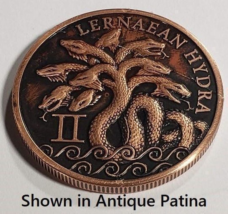 a close up of a coin with a tree on it