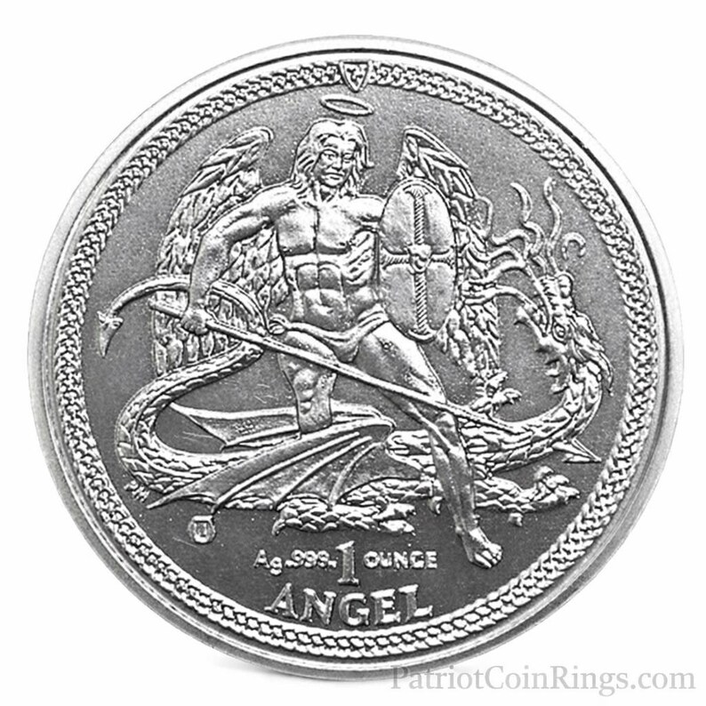 The image is a silver coin featuring an angelic figure with wings and a shield, holding a sword and shield, surrounded by a dragon. The coin has the text "ANGEL" and "1 OUNCE" printed on it.