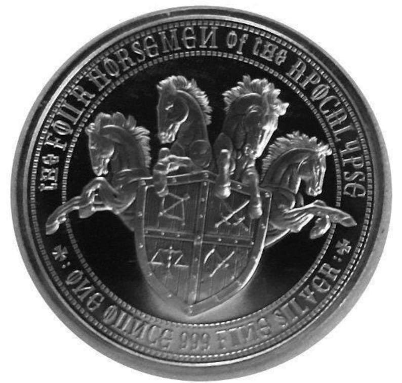 a silver coin with a horse and shield on it
