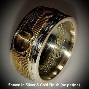 a gold and silver ring with the words showin silver and gold finish