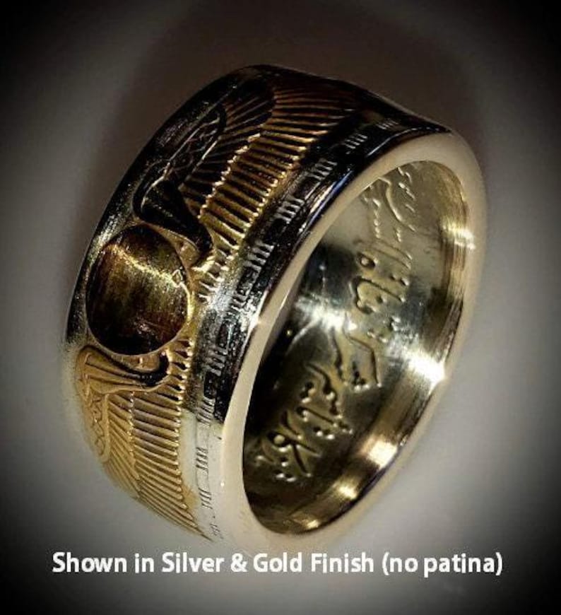 a gold and silver ring with the words showin silver and gold finish