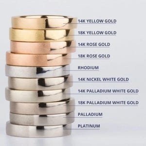 a stack of gold and silver wedding bands