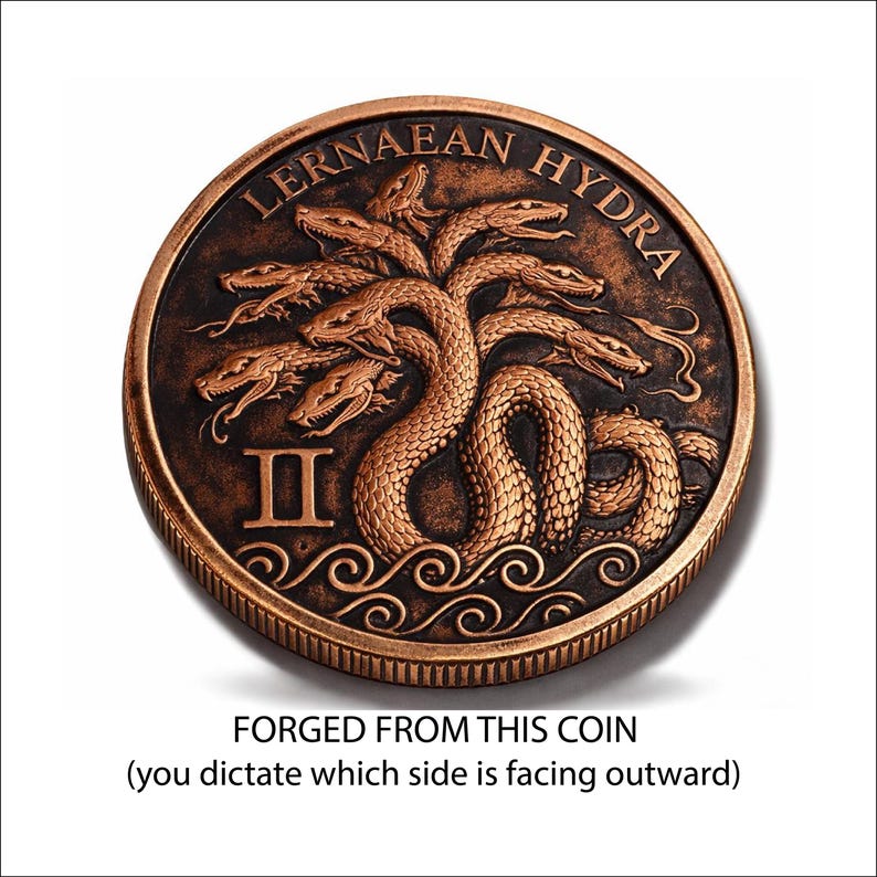 a coin with a detailed design of a snake and waves, and the text "Lernaean Hydra" around the top edge. The coin is described as "Forged from this coin" and "(you dictate which side is facing outward)" in the provided text.