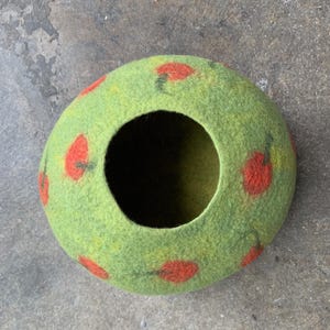 Felted vessel, pure wool. Green nuances with red dots, apples or tomatoes.