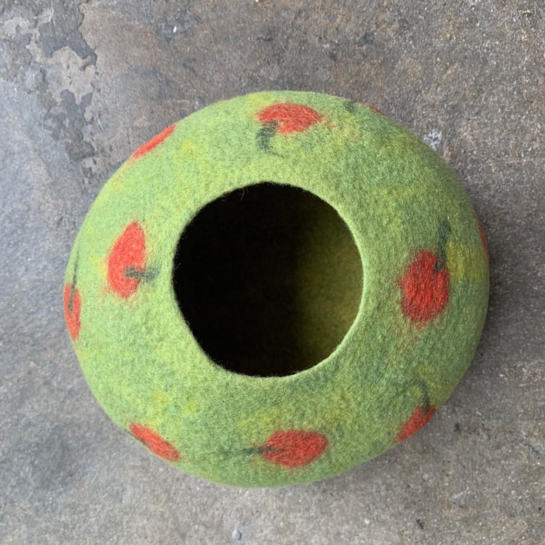 Felted vessel, pure wool. Green nuances with red dots, apples or tomatoes.
