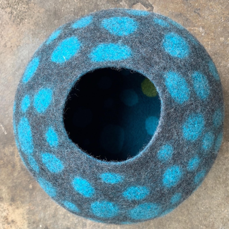 Felted vessel. Pure wool. Blue dots on a grey background. Inside is blue, also with dots.