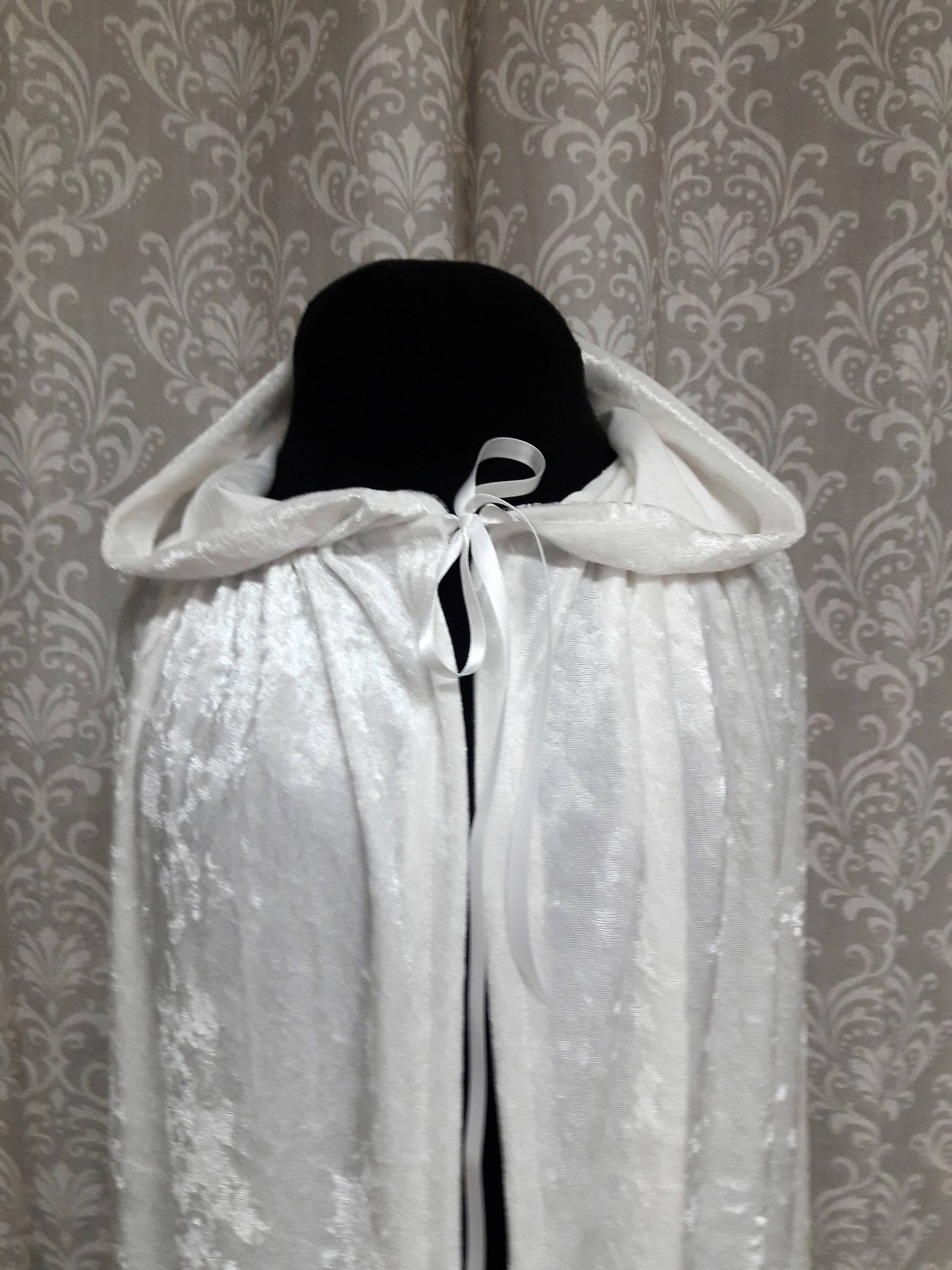 white cloak with hood and sleeves