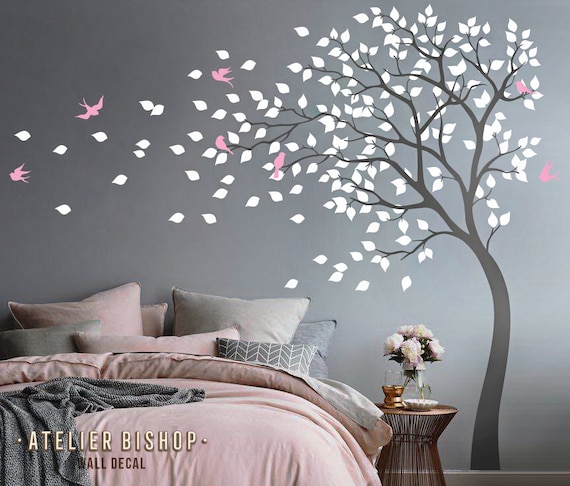 bending tree in the wind with birds and loose leaves wall | etsy
