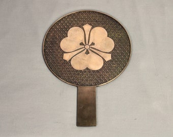 Large antique Japanese bronze mirror, heavy cast, samurai family crest, signed inscription 19thC, kiri blossoms, original black lacquer case