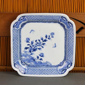 Large antique 12&quot; square Japanese blue white porcelain plate, large peony blossoms, ornate borders, Buddhist treasures, inscription, Meiji