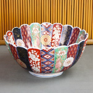 Large fine antique Japanese Imari bowl, all hand-painted, colorful sculpted, foliated, minor flaws, inscription signed Hōtei, C.1890, Meiji