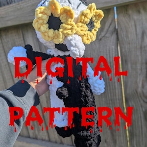 Puede incluir: Muñeca de ganchillo hecha a mano con cuerpo blanco y negro, sombrero negro y detalles de girasol amarillo. El texto "DIGITAL PATTERN" se muestra en rojo, con letras goteando.
