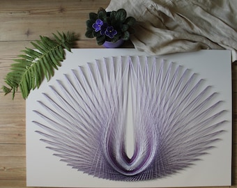 May include: A purple and white string art piece in the shape of a U, created by wrapping string around nails hammered into a white board.