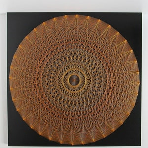 May include: A circular string art piece with a geometric design. The artwork is made with orange and yellow thread on a black background.