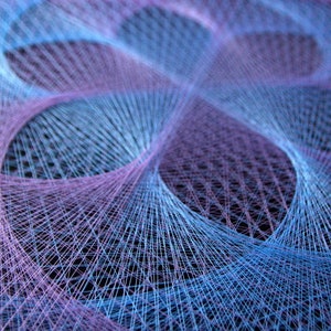 May include: A close-up of a colorful string art piece with a geometric pattern. The string is woven in a criss-cross pattern, creating a series of overlapping circles. The colors of the string are blue and purple.