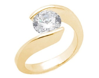 May include: A gold ring with a single round diamond set in a unique, curved design.