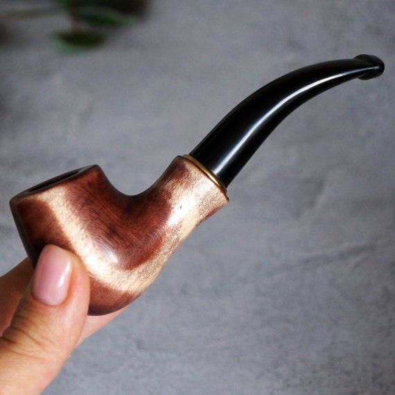 A beautifully turned pear-wood mini smoking pipe — real craft object, warm grain, and 42 favorites say pipe enthusiasts have already noticed.
