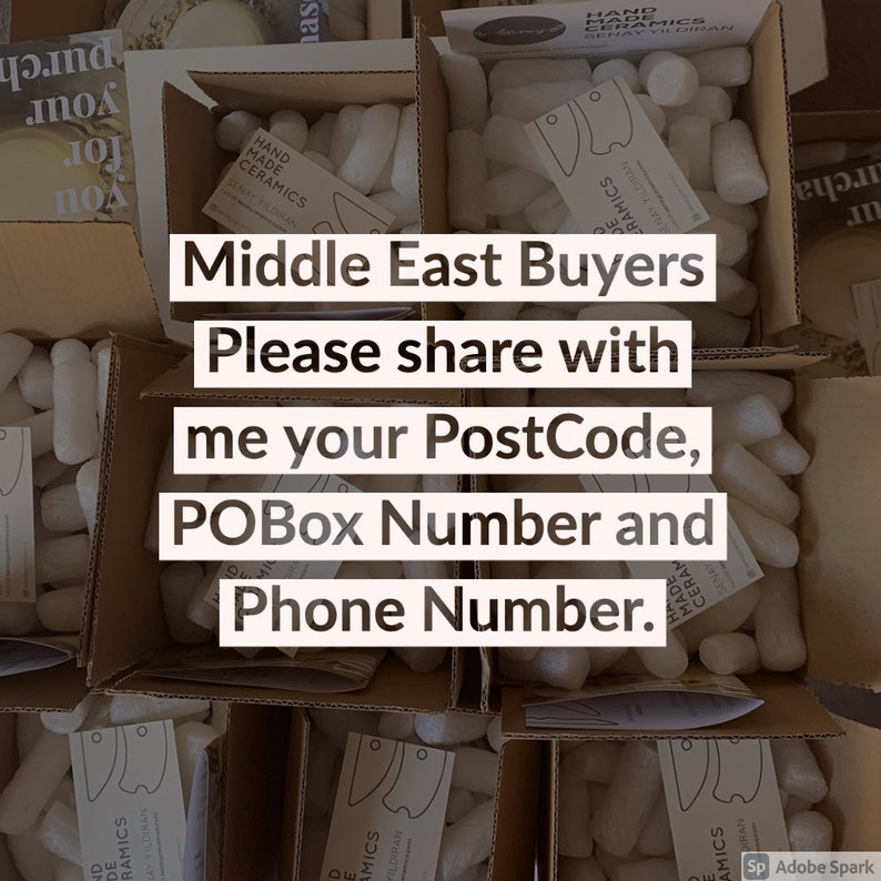 May include: A close-up of several cardboard boxes filled with packing peanuts. The boxes are labeled "Hand Made Ceramics" and have a message for Middle East buyers to share their PostCode, POBox Number, and Phone Number.