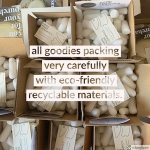 May include: Multiple open cardboard boxes filled with white biodegradable packing peanuts. Each box contains a white rectangular card labeled HAND MADE CERAMICS SENAY YILDIRAN. Text overlay reads: all goodies packing very carefully with eco-friendly recyclable materials.