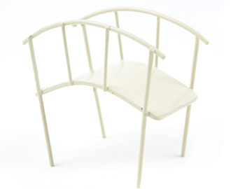 May include: A white metal bridge with a curved design. The bridge has a flat top and railings on the sides.