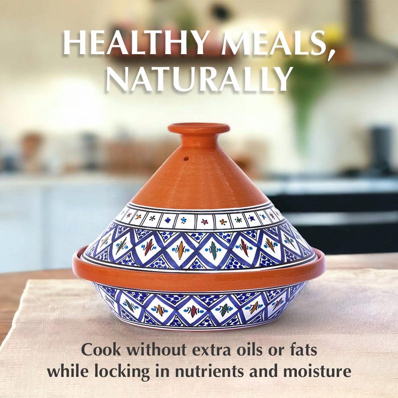 May include: A terracotta tagine with a conical lid featuring blue and white geometric patterns and small colorful accents. The text reads: HEALTHY MEALS, NATURALLY. Cook without extra oils or fats while locking in nutrients and moisture.