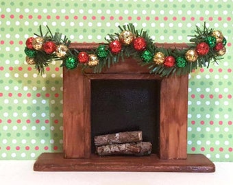 Miniature Dollhouse Christmas Fireplace..Stained wood with Christmas swag decorated with red, green and gold balls