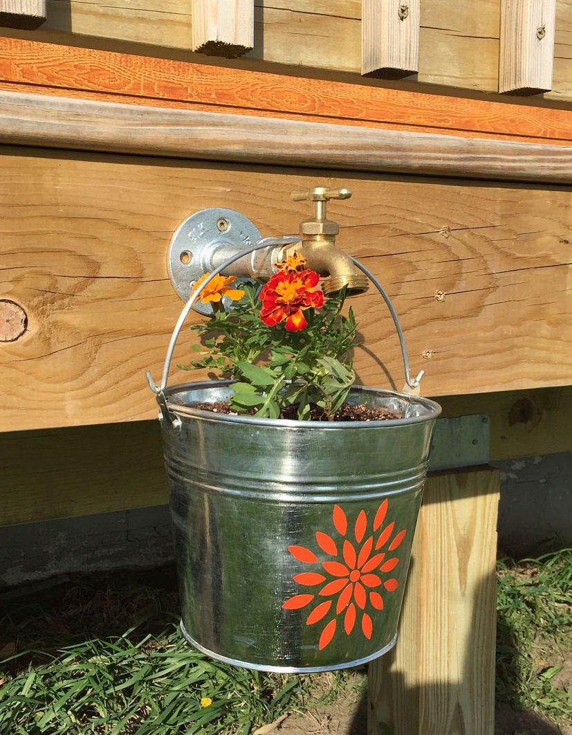 Galvanized Flower Bucket Hanging from Water Spout Secure to Side of