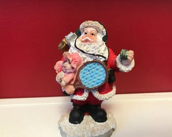 Vintage Santa Figurine with headphones, toys, tennis racket,  K’s Collection