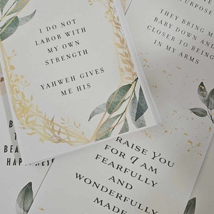 May include: A set of four cards with watercolor floral designs and inspirational quotes. The quotes are: "Yahweh strengthens me with", "I do not labor with my own strength", "Raise you for I am fearfully and wonderfully made", and "Each wave purpose they bring my baby down and closer to being in my arms".