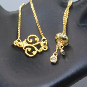Antique gold filigree quatrefoil Tassel Bracelet on a BOLO style Chain