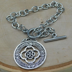 Stainless Steel Celtic Charm on a Stainless Steel Bracelet link style chain