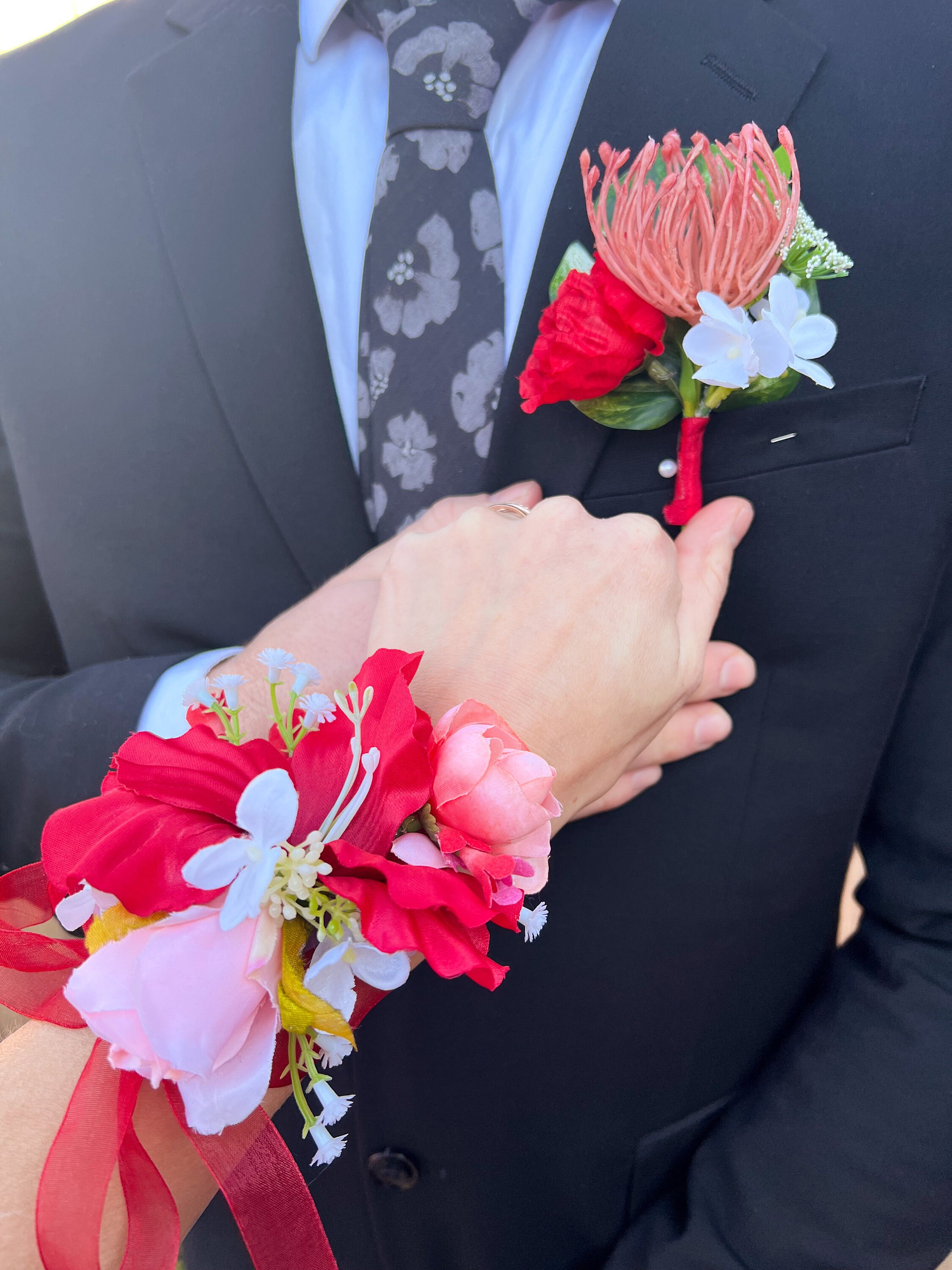 Red corsage and boutonniere for prom discount