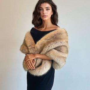 May include: A woman wearing a black dress with a long, light brown fur shawl.