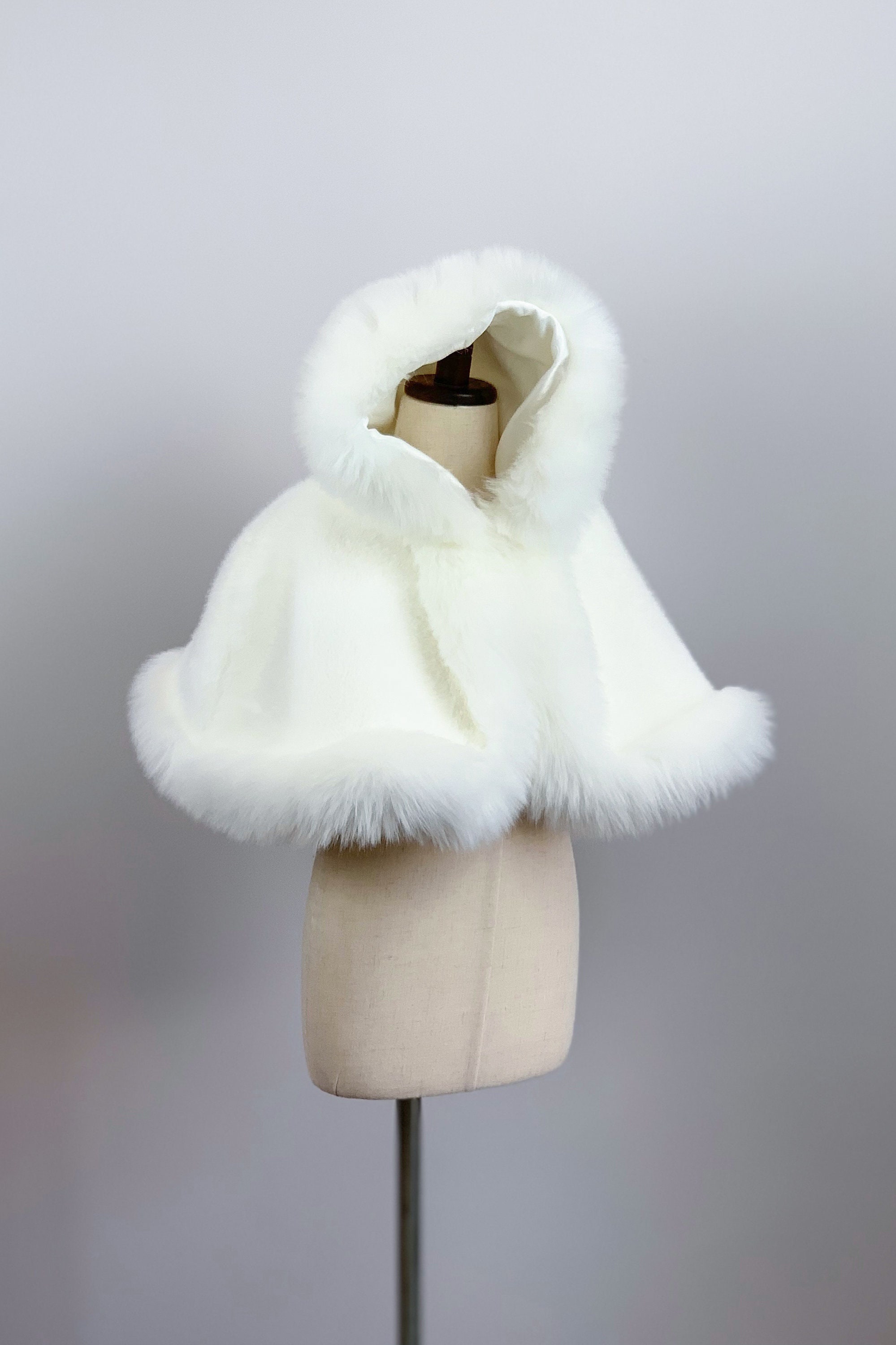 white faux fur cloak