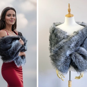 May include: A gray faux fur shawl with a soft, fluffy texture. The shawl is draped over a mannequin and is perfect for adding a touch of elegance to any outfit.