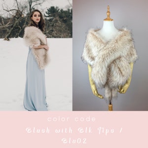 May include: A faux fur shawl in a blush color with black tips. The shawl is draped over a mannequin and a person wearing a light blue dress. The text "color code Blush with Blk Tips / Blu02" is displayed below the image.