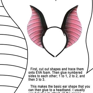 May include: A black headband with attached bat ears. The ears are pink with black tips and have a textured, ribbed design. The text "Bat Ear Template" is at the top of the image.