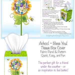 May include: A colorful tissue box cover with a sunflower design. The cover is made from fabric and includes instructions for making it. The text on the cover reads "Achoo! Bless You! Tissue Box Cover Fabric Art Panel & Pattern Quick, Easy, and Fun The perfect gift for a friend under the weather - or an inspiration to feel better!"