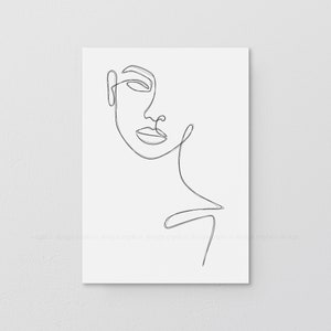 May include: A monochrome line drawing of a woman's face. The artwork is a single continuous line, showing the profile of a face with an eye, nose, and lips. The print has the text "EXPLICIT DESIGN" and "@explicit" at the bottom.